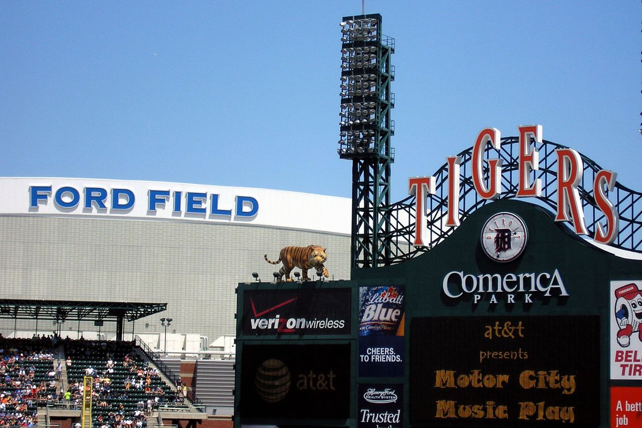 The Ford Field and Comerica Park signs in downtown Detroit