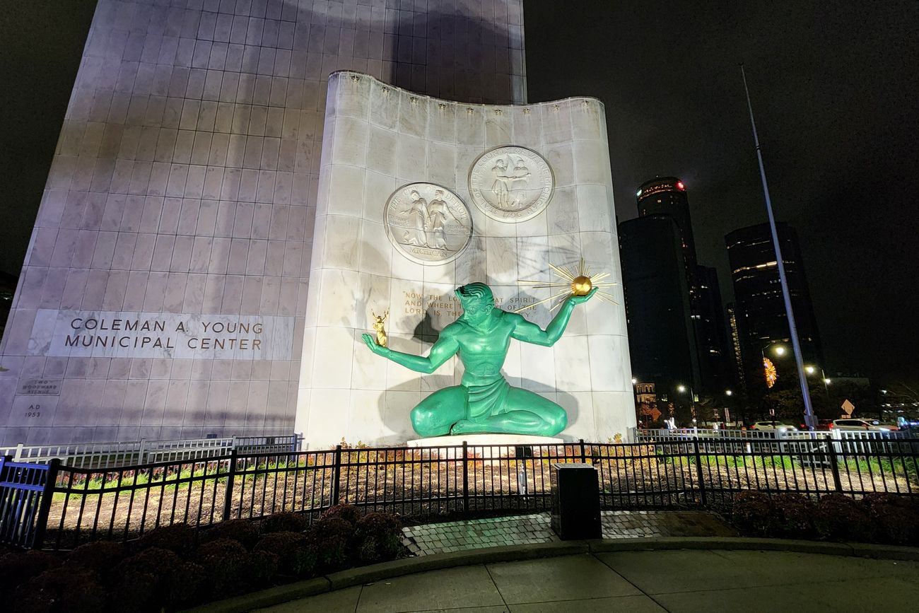 The Spirit of Detroit sculpture lit at night